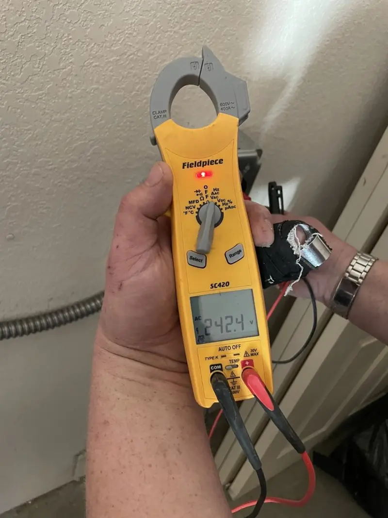 Voltage testing with clamp meter during Electrical Installation Services in Hoffman Estates